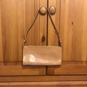 Small shoulder or clutch purse. Says Monsac on inside fabric.